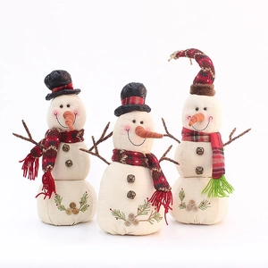 Three handmade linen Christmas snowmen dolls with embroidery and twig arms for holiday decor