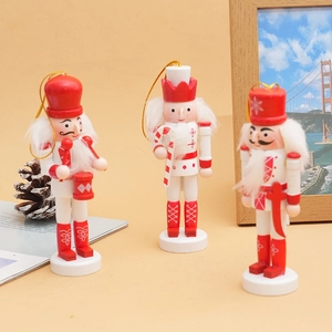 Detailed view of three 12cm wooden nutcracker soldiers with glitter and festive patterns