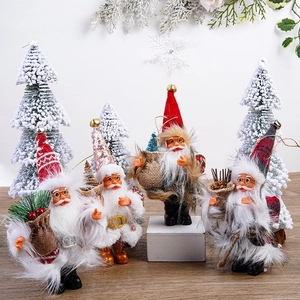 Set of four 5-inch plush Santa Claus figurines standing for festive party decor