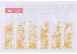 Detailed view of MDHZ-14 gold hollow metal nail art charms in a 6-grid transparent pack