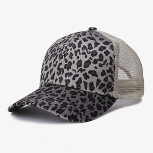 Detail view of leopard print baseball cap with cream breathable mesh back and curved brim