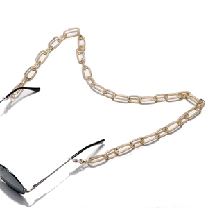 Flat golden oval link eyeglass chain with embossed texture and silicone ends
