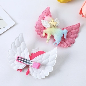 Glitter unicorn and angel wing hair clips for girls with rainbow details and pink finish