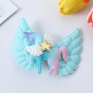 Detail of glitter unicorn hair clip with angel wings and star for girls' accessories