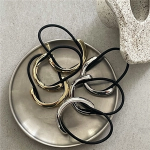 Minimalist metallic half-round ponytail cuffs in polished gold and silver finishes