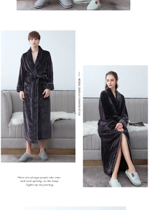 Detailed view of thick flannel bathrobes featuring contrast piping and soft fleece texture