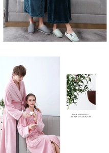 Detailed texture of thick pink flannel couple bathrobe with cozy matching home slippers