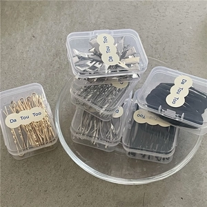 Variety set of gold, silver, and black metal hair clips in clear organizer boxes