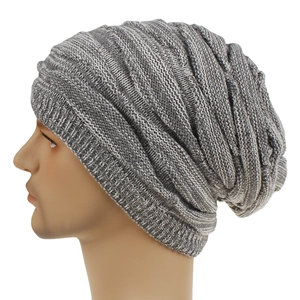 Detailed side view of grey slouchy beanie with diamond knit pattern and ribbed edge