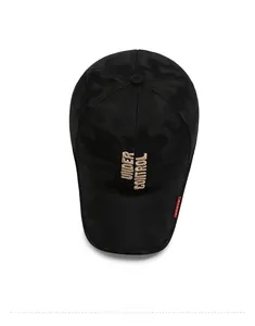 Detail of black camo baseball cap with gold Under Control embroidery and red side label