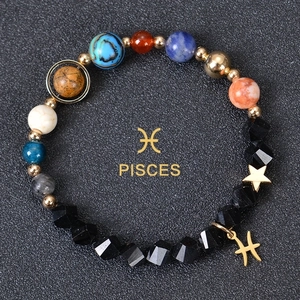Detailed macro view of Pisces zodiac beaded bracelet with various natural stones and star charm
