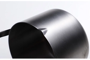 Detailed macro view of high-quality stainless steel cup rim and brushed metal texture