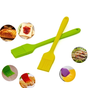 Green and yellow silicone basting oil brushes for BBQ grilling and baking pastries