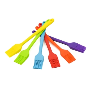 Set of 6 colorful silicone basting brushes in a fan arrangement for BBQ and baking
