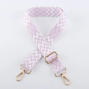 Detail of adjustable lavender woven shoulder strap with gold metal lobster clasps