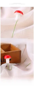 Close-up of mini red foam mushrooms with white spots and green wire stems for crafts