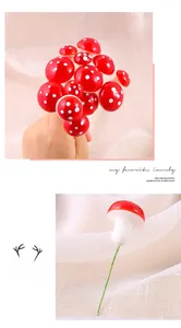 Close-up of mini red foam mushrooms with white spots and wire stems for DIY decor