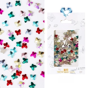 Detailed view of colorful butterfly nail art rhinestones with professional packaging