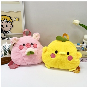 Close-up of plush cartoon pig and chicken backpacks with soft fabric and clover details