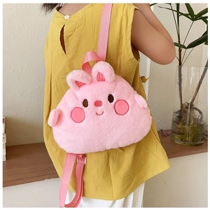 Pink plush cartoon backpack for kids featuring cute 3D ears and soft embroidered details