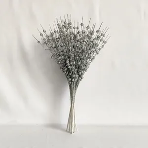 Macro detail of silver glitter berry stems for Christmas tree and wedding decoration