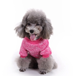 Detail of rose pink knitted dog sweater showing soft fleece texture and crew neck design
