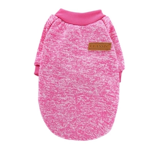 Detail of pink snowflake knit dog sweater with ribbed cuffs and leather classic tag