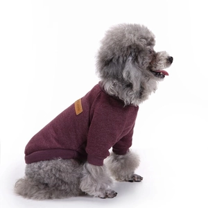Close-up of wine red knitted pet sweater with Classic leather label detail for small dogs