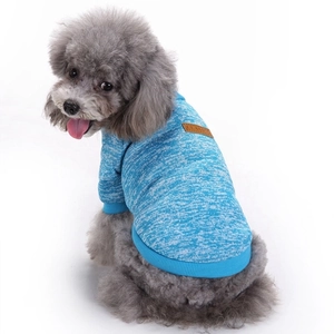 Detailed view of blue knitted pet sweater with classic leather tag for small dogs