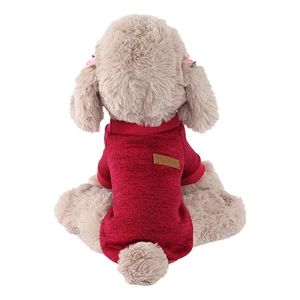 Detail of red knit pet sweater with classic leather patch on back for small dogs