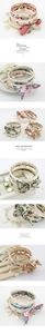 Detail of layered bracelet set with gold rings, faux pearls, and floral silk bows