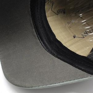 Detail view of the internal sweatband and reinforced lining of a baseball cap