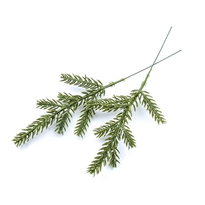 Detail of two artificial green pine needles for Christmas floral table arrangements