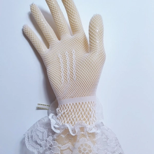 Detailed view of white fishnet lace gloves with elegant ruffled edges for tea parties