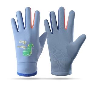 Detail of blue kids ski gloves featuring a green cartoon dinosaur and Sport Boy text