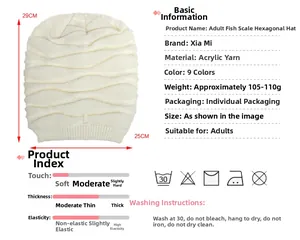 Detail view of cream knitted beanie with diamond weave pattern and warm acrylic fabric