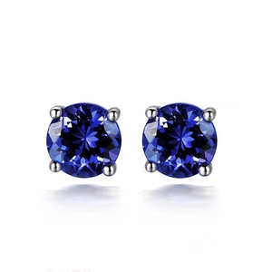Elegant silver four-prong stud earrings with brilliant round blue sapphire crystals