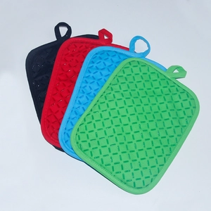 Detailed set of colorful heat-resistant silicone pot holders with non-slip texture and hanging loops