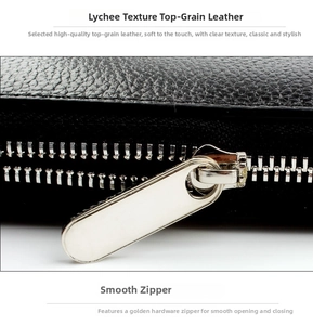 Detail view of premium black litchi grain cowhide leather and durable metal zipper