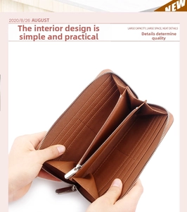 Close-up of brown leather long wallet interior showing card slots and zipper pocket