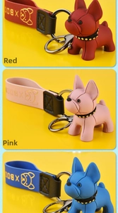Detailed views of French Bulldog keychains in red, pink, and blue with silicone straps