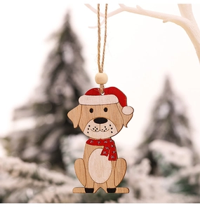 Detail of wooden dog Christmas ornament with red scarf hanging on white branches
