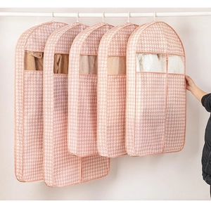 Detail of pink houndstooth garment covers with transparent PEVA window for easy viewing