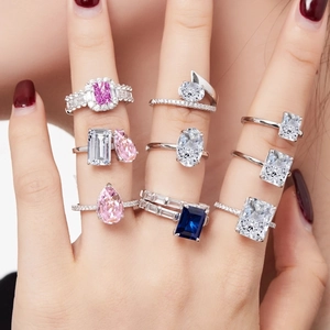 Detailed view of multiple S925 sterling silver rings with vibrant 8A cubic zirconia