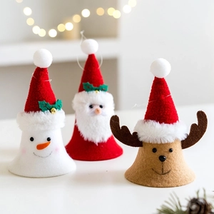 Three Christmas felt tabletop ornaments featuring Santa, Snowman, and Reindeer with bells
