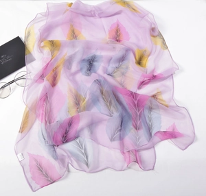 Detail of purple leaf print scarf with 100% silk feel texture and lightweight design