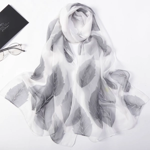 Elegant white chiffon long scarf featuring grey leaf prints and soft drapes for women