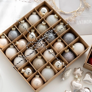 Set of 24 gold and silver Christmas ornaments in a kraft box for holiday tree decoration