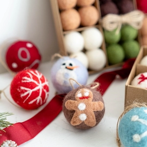Handmade Christmas wool felt ornaments set featuring gingerbread man and snowflakes