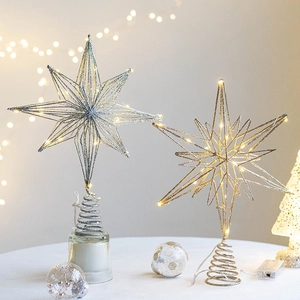 Golden and silver iron Christmas tree top stars with LED lights on spiral bases